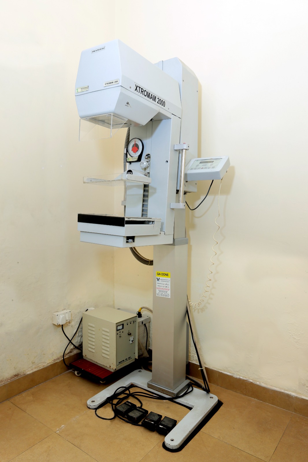 Patient undergoing an MRI scan in a modern GE machine.